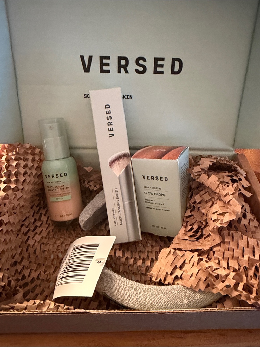 VERSED Glow Drops skin tint and brush